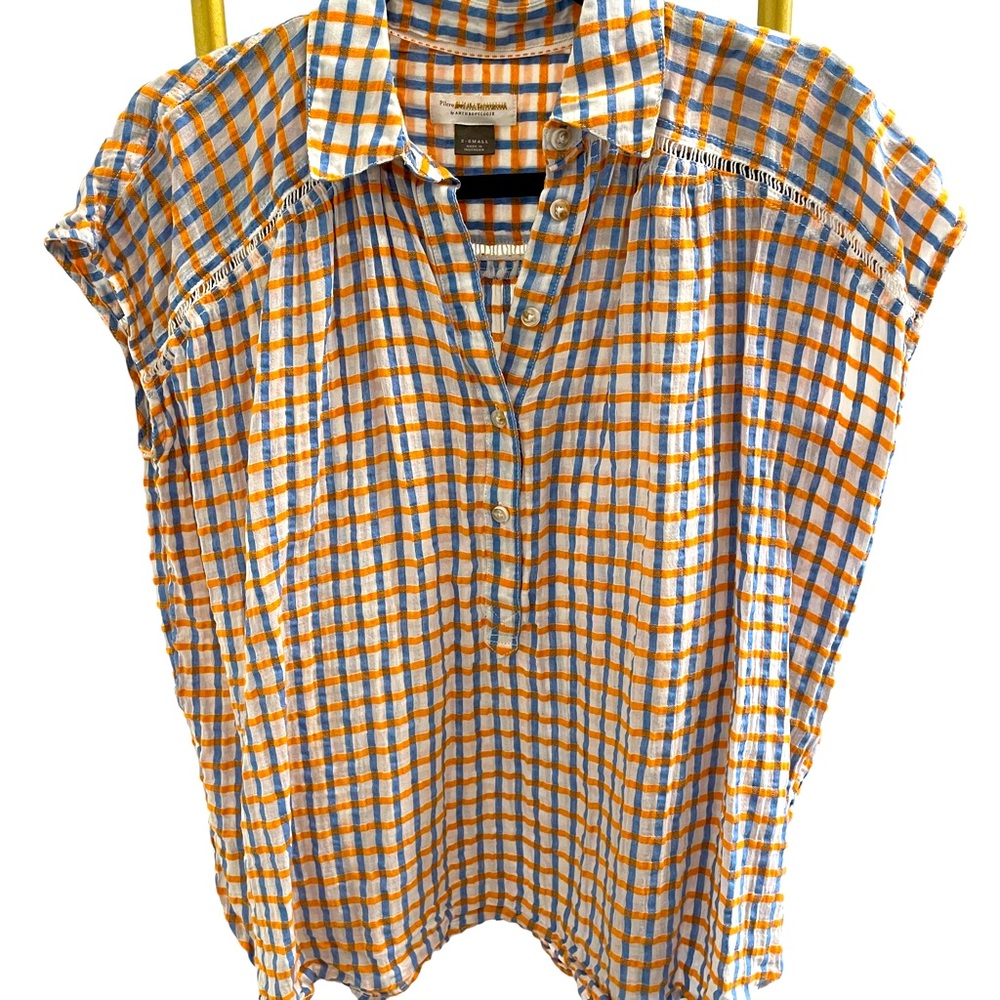 Serena Surf Henley blouse by Anthropologie.